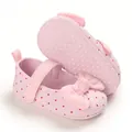 Detailed view of pink polka dot baby girl princess shoes with soft soles for pre-walking. - Pink