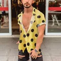 Detailed view of men's slim fit yellow Hawaii beach shirt with bold black polka dots - S / Tops / Yellow