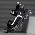 Side view of black breathable kids sports sandal featuring camouflage sole and Velcro straps - 27 / Black and White