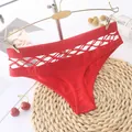 Detailed close-up of red sporty women's panties featuring a hollow-out lattice waistband. - XL / Red