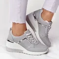 Side view detail of grey platform sneakers featuring silver metallic trim and laces - 35 / Gray