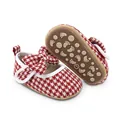 Detail of red houndstooth baby walking shoes with bow and anti-slip sole for girls. - Insole Length 11cm / Red