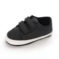 Detailed view of black baby walking shoes with soft soles and velcro straps - Black