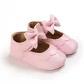 Detailansicht pinkfarbener Baby-Lauflernschuhe für Mädchen mit Schleife und Wellenrand - Rosa