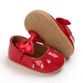 Detailed view of red patent baby girl princess shoes with non-slip soft rubber sole - Red