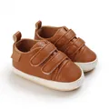 Detailed macro view of brown faux leather baby walker shoes featuring soft soles and velcro - Bottom Length 11CM / Brown