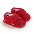 Detailed view of red infant walking sandals featuring mesh fabric and cute bear embroidery - Red