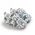 Detailed view of soft-sole baby walking shoes with cute animal prints and velcro strap - Light Blue Cartoon
