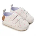 White soft sole baby walking shoes featuring pink heart patterns and adjustable velcro straps - D73 White Heart
