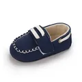 Elegante marineblaue Baby-Mokassins mit weicher Sohle und weißen Zierstreifen - Blau