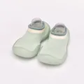 Detail view of breathable baby sock shoes with light green knit and flexible soft sole. - Fruit Green