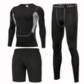 Detail view of a 3-piece men's black compression sports suit with grey stitching - S / Set / Black (Grey Stitching)