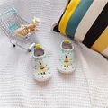 Detailed top view of blue baby canvas shoes featuring cute lion print and elastic bands - Lion
