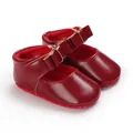 Detailed view of elegant red baby girl princess pre-walker shoes with stylish bow straps - Red