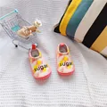 Close-up detail of pink patterned baby walking shoes with sugar print on soft elastic fabric - Sugar Balloon