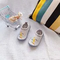 Detailed lifestyle view of soft striped baby canvas slip-on shoes for toddlers - Striped Pencil