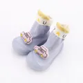 Close-up detail of blue baby sock shoes featuring a cute pink cartoon car plush doll - Size 18/19 (11.5cm) / Blue Car