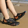 Children's black water shoes with vibrant orange accents and adjustable sport strap - Black