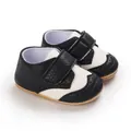 Detail of black and white baby toddler shoes with non-slip sole and hook-and-loop strap. - Inner Length 11cm (66g) / Black