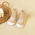 Soft beige knitted baby sock shoes featuring a cute panda cartoon and flexible white soles - Beige Bear Dot Glue (White Base)