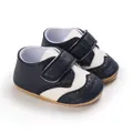 Detailed view of navy blue and white faux leather infant walker shoes with velcro straps - Dark Blue