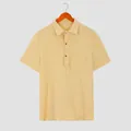 Close-up of beige men's waffle knit short sleeve shirt with buttoned polo collar - Yellow