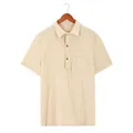 Dettaglio di polo beige a maniche corte in maglia a nido d'ape con taschino sul petto - Taglia S / Top / Albicocca