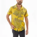 Close-up of a men's yellow casual short-sleeved shirt with fern leaf prints on a model - S / Tops / Yellow