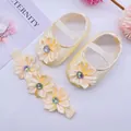 Close-up of cream satin baby princess shoes and matching flower rhinestone headband set - Size 11 / Rhinestone Flower (Beige) / Beige