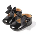 Elegantes zapatos de princesa para bebé en charol negro con lazo grande y suela blanda - Negro