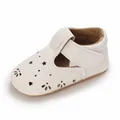 Side view of white leather baby walking shoes with perforated heart and star designs - Inner Length 11cm / White