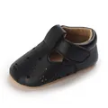 Close-up view of black leather baby walker shoes featuring delicate floral cutout patterns - Inner Length 11cm / Black