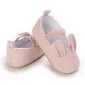 Close-up view of cute pink baby girl pre-walker shoes with 3D bunny ears details - Pink