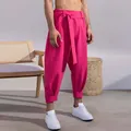 Detail of men's fuchsia cropped leisure pants featuring a unique waist tie design - S / Bottoms / Pink