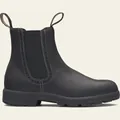 Vista detallada de botines Chelsea de cuero negro con elegantes perforaciones brogue - Negro