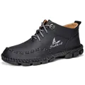 Side view of men's black handmade mid-top Martin boots with textured leather - 38 / Black