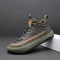 Side view of olive green high-top leather sneaker with refined suede texture details - 38 / Green