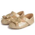 Elegant gold toddler princess shoes with sparkling glitter toes and crown bow details - Gold