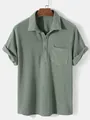 Detail view of a sage green men's short-sleeved shirt with a premium waffle grid texture - Green