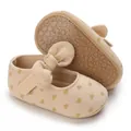 Detail view of soft-soled beige baby walking shoes with gold heart pattern and bow detail - Heart Print Rubber Sole (D79)