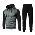 Detailed view of men's sports tracksuit set featuring gradient dot print and zip-up hoodie - S / Top And Bottom / Gray