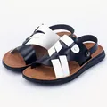 Men's outdoor leather sandals featuring black and white woven straps and soft soles. - Black and White