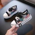 Colorful plaid low-top children's canvas shoes with velcro and daisy detail. - Inner Length 13.5cm Size 21 / Black