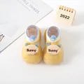 Detail view of yellow cartoon bunny baby walker sock shoes with soft anti-slip soles - Yellow (Bear Letters)
