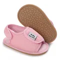 Close-up detail of pink mesh baby sandals featuring a non-slip soft rubber sole texture - Pink