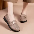 Elegant taupe women's loafers featuring a stylish perforated design and a gold decorative buckle - 38 / Perforated Bean Paste Pink