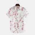 Close-up view of a men's white casual shirt featuring a pink floral branch pattern - S / Tops / White