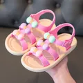 Detailed view of pink toddler girl's sandals with colorful bows and soft soles. - 24 / Pink