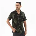 View of the green fern leaf pattern and chest pocket on a casual short-sleeve shirt - S / Tops / Black