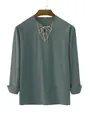 Detail of men's teal casual shirt with ethnic embroidery and drawstring V-neckline. - Dark Green